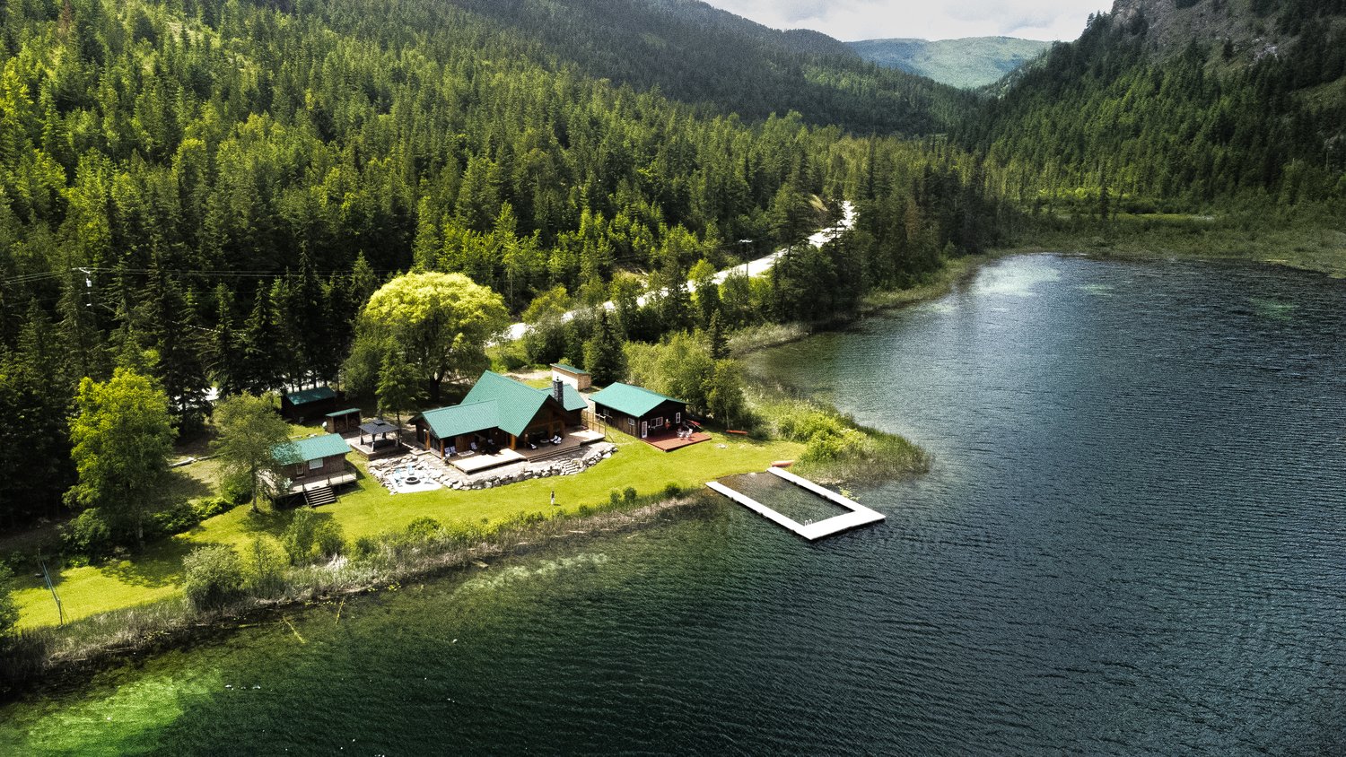 Drone image of a resort on a lake.