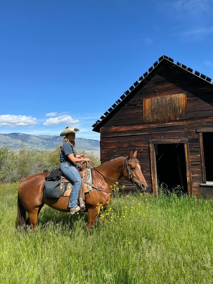 Woman riding horse at Sundance Guest Ranch