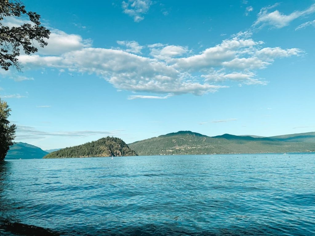 View of Shuswap Lake in Salmon Arms on a clear day with blue skies and some clouds